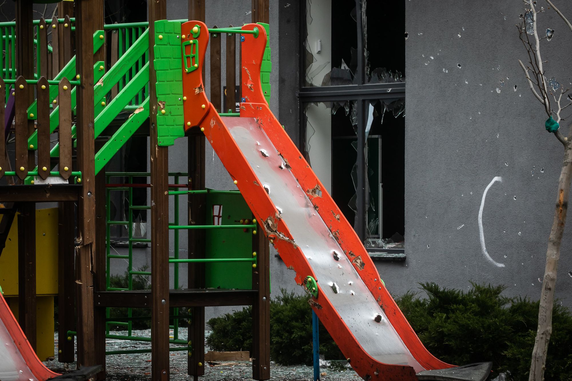 A children's playground and building shot up during Russia's war in Bucha, Ukraine