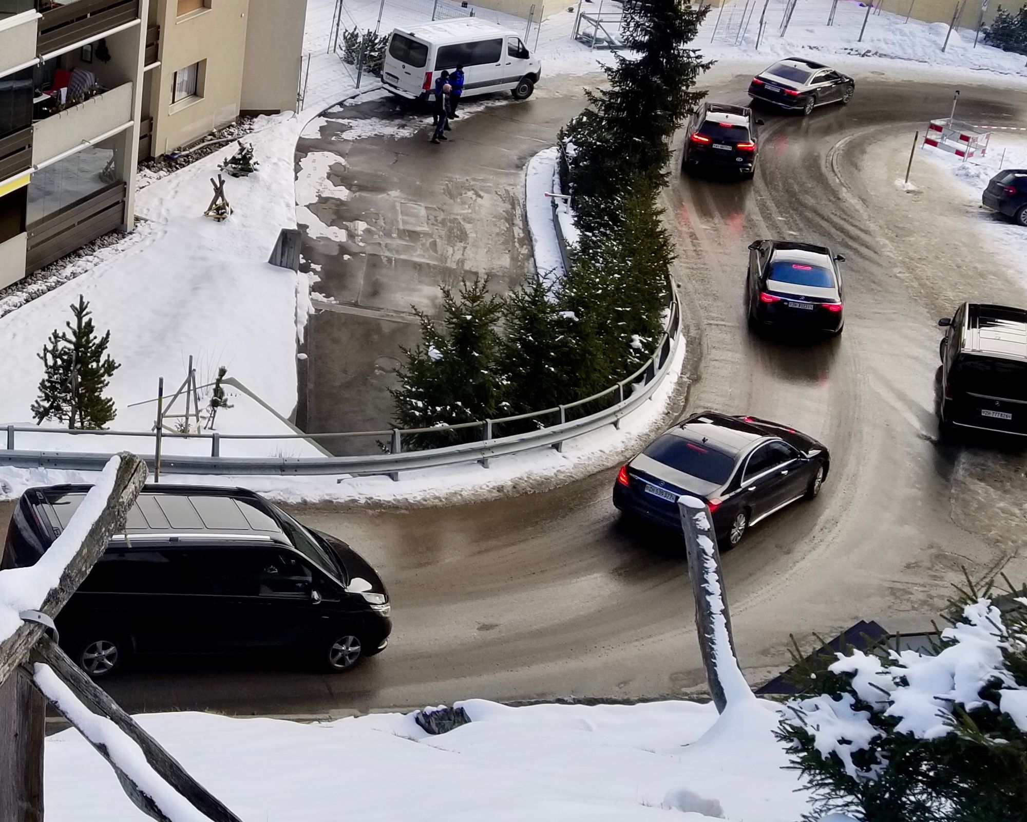 Chauffeured cars bearing Davos visitors along a highly guarded route 