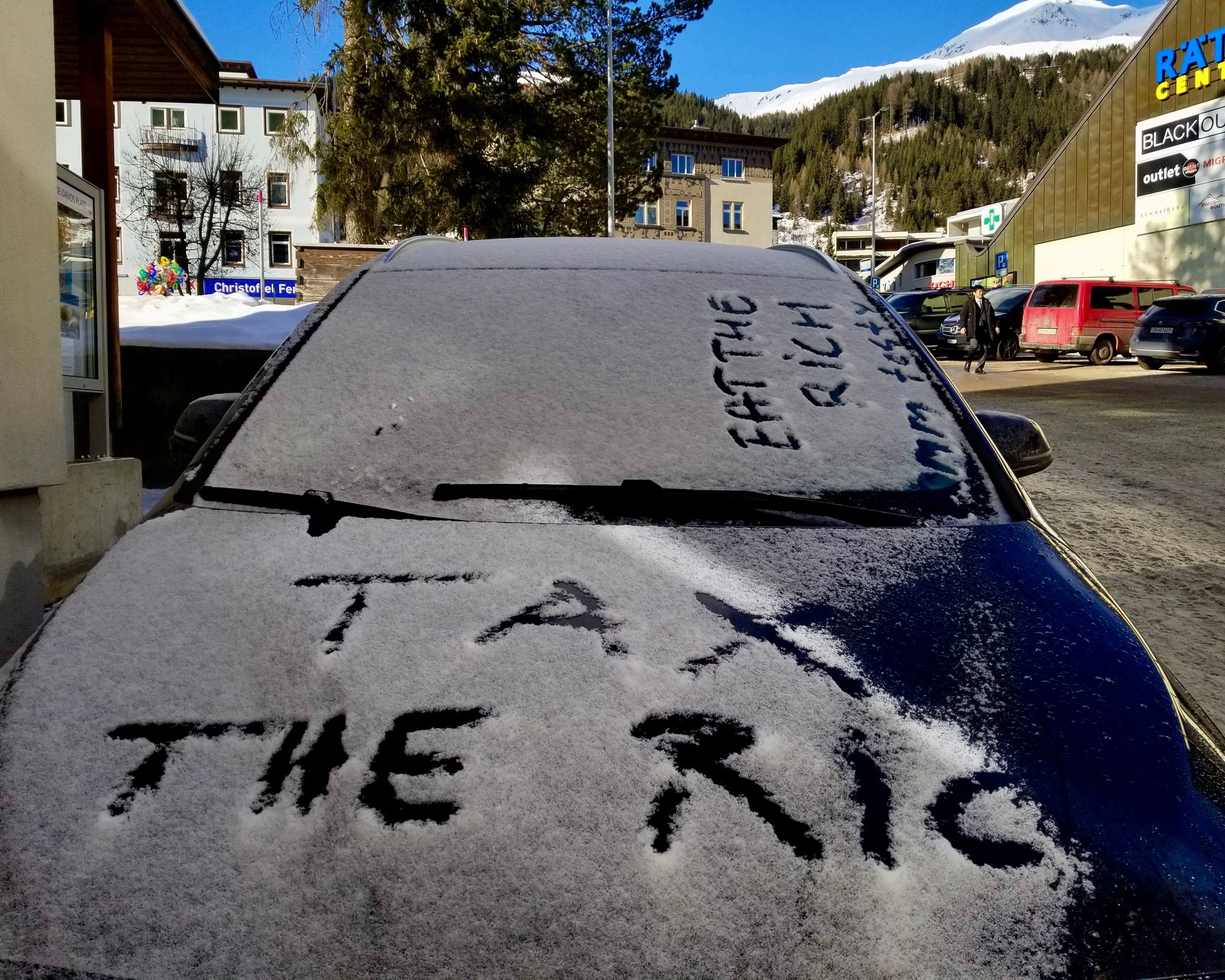 A message in the snow on a car at Davos during the WEF gathering