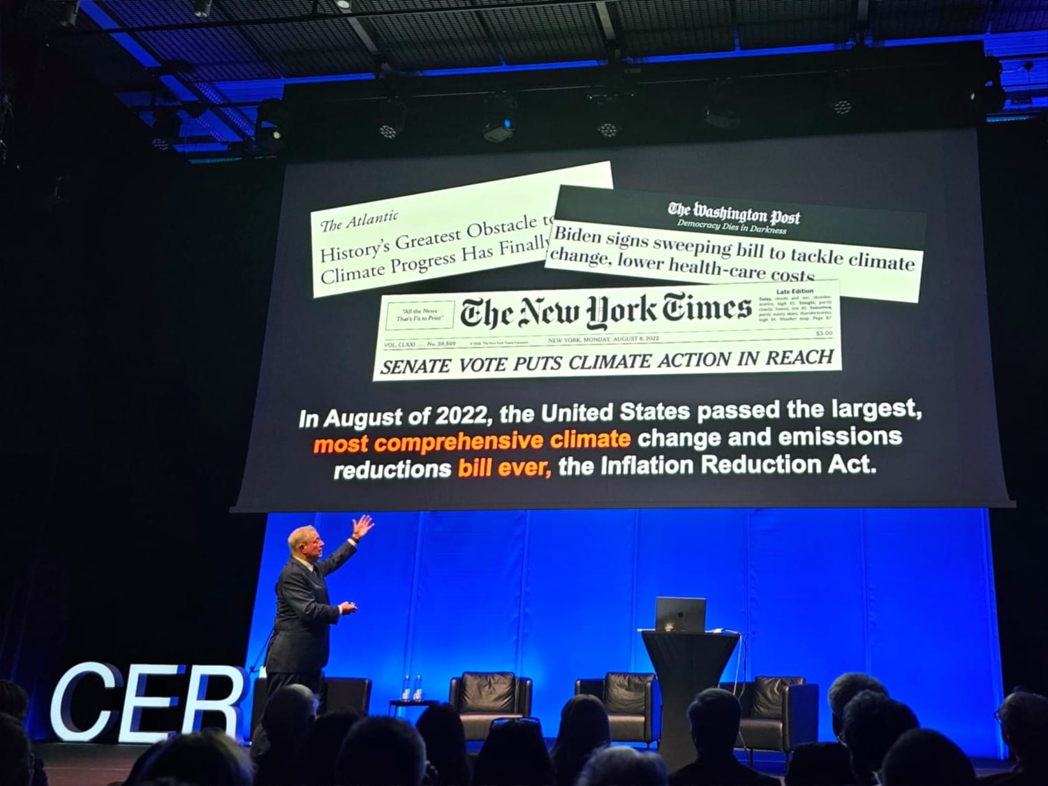 The former U.S. vice president, Al Gore, speaking at CERN, points to a slide in his presentation.