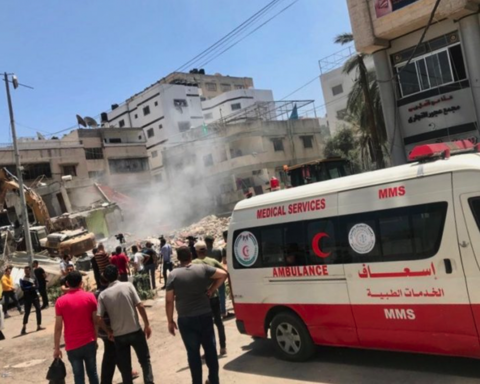 People inspect the rubble from an Israeli airstrike in Gaza City