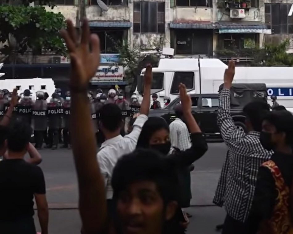 Protesters in Myanmar raise a three-fingered salute in solidarity and resistance against the military coup