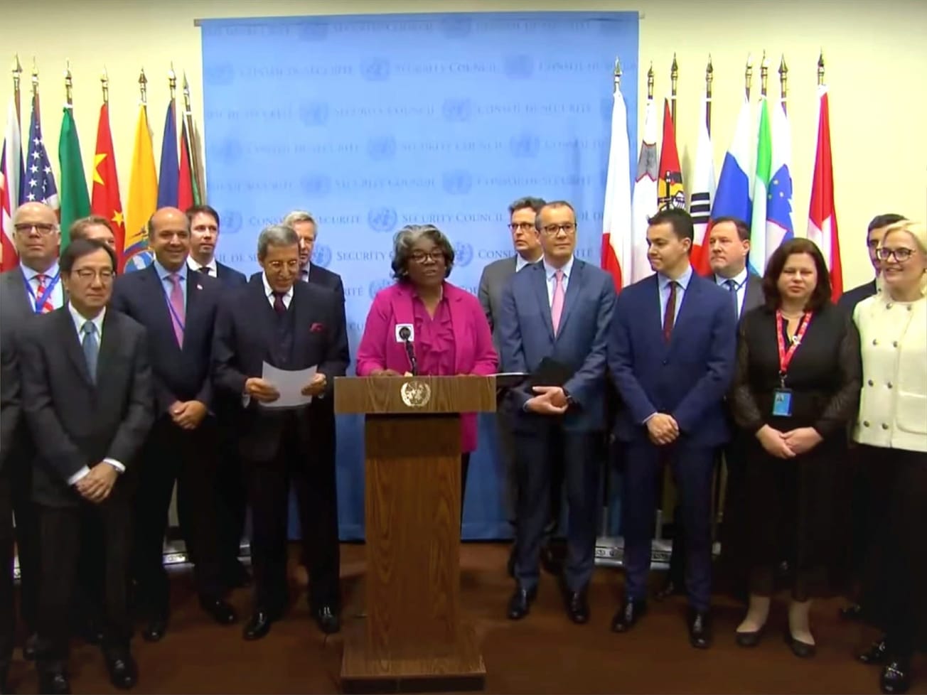 The U.S. ambassador, center, leads a U.N. press conference on AI