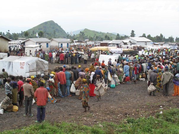 Crowds of people hope for more than half-rations at Congo's Kibati camp.