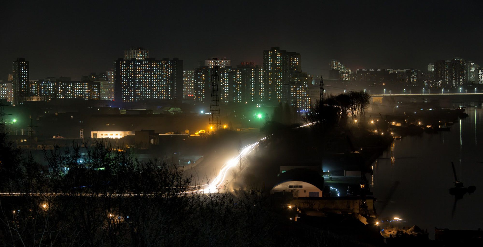 A hotel balcony view of Pyongyang at night. 