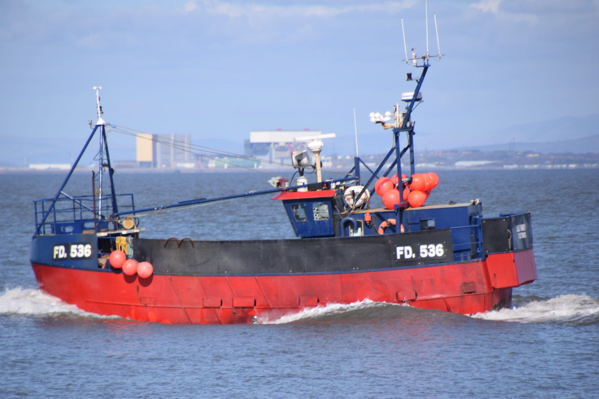 A fishing boat passes Heysham nuclear power station in the U.K.