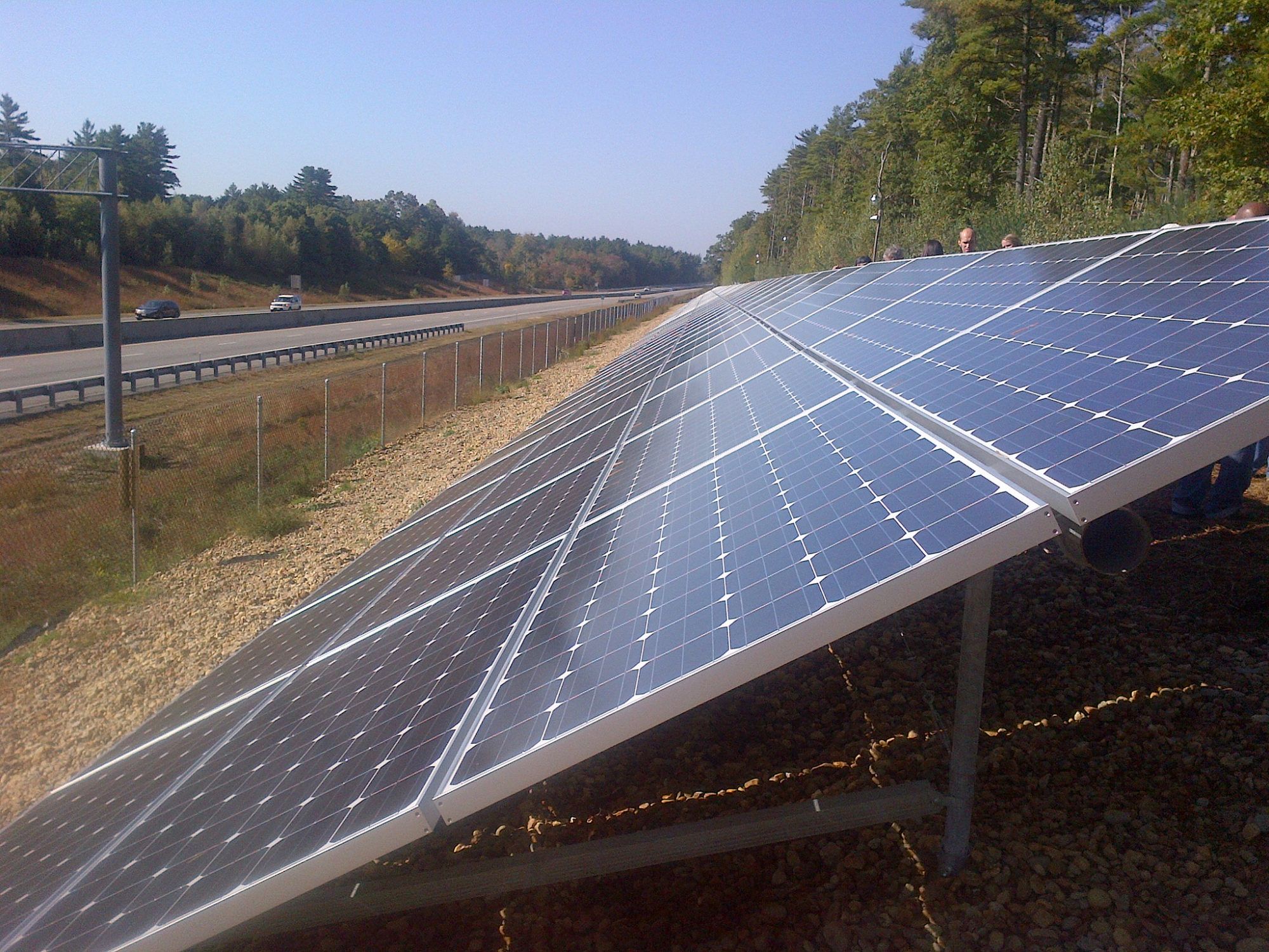 Solar array built with U.S. grant money on a Massachusetts highway to power a water treatment plant.