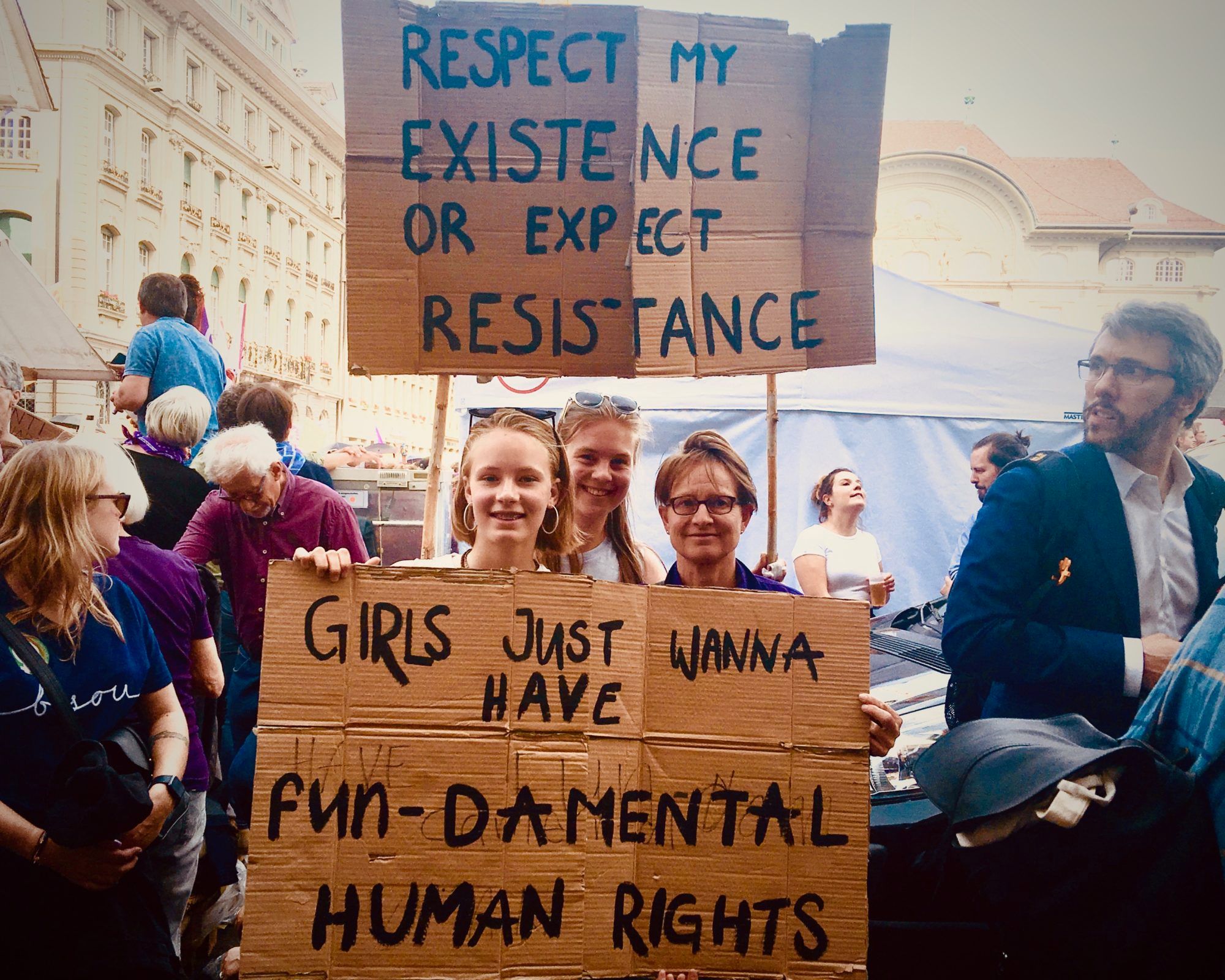 Anita Krattinger and daughters Maya, left, and Fiona, center, at Bern's Bundesplatz. 